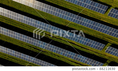 Drone shot of solar panel rows at a solar power facility Drone shot of solar panel rows at a solar power facility 88211630