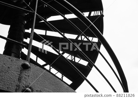 Spiral staircase against gray sky 88211826