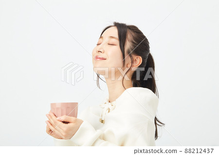 A young lady with a mug A young lady with a mug 88212437