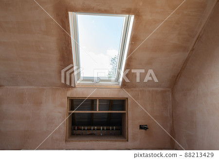 Loft renovation conversion project, brown plastered walls 88213429