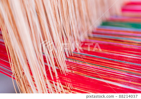 Thai and Asian Style Vintage textile thread machine to make traditional clothing and fabric pattern weaving. 88214037