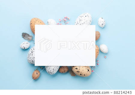 Easter greeting card over easter eggs 88214243