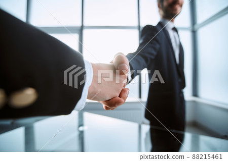 image is a confident handshake of business partners. image is a confident handshake of business partners. 88215461