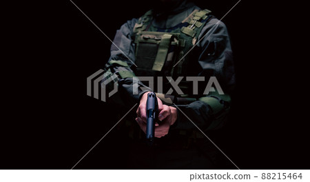 Soldier holding a pistol 88215464