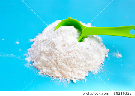 Baking soda on blue background. Baking soda on blue background. 88216322
