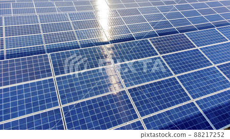 Aerial drone view flight over solar panels on sunny day close-up. Photovoltaic Aerial drone view flight over solar panels on sunny day close-up. Photovoltaic 88217252