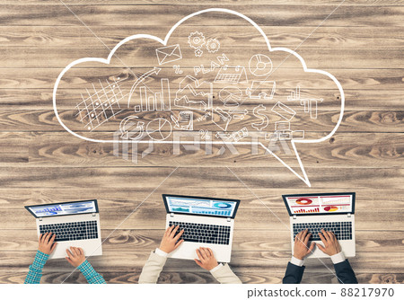 Top view of businesspeople sitting at table and using gadgets Top view of businesspeople sitting at table and using gadgets 88217970