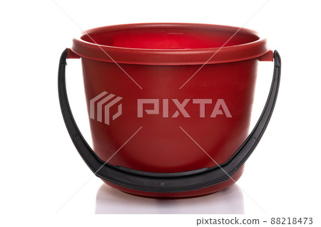 empty red plastic bucket with black handle on white background empty red plastic bucket with black handle on white background 88218473