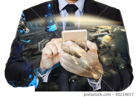 Double exposure of hand hold smart phone with world background Double exposure of hand hold smart phone with world background 88218657