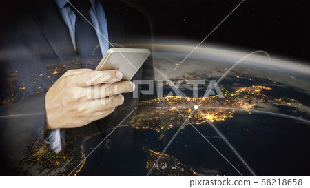 Double exposure of hand hold  smart phone with world background 88218658
