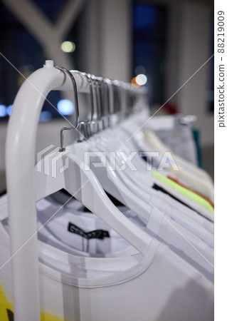 Fashion clothes on clothing rack, Bright colorful cotton shirts on hanger in boutique shop. 88219009