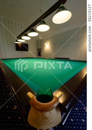 Billiard table in the hotel, sports game for relaxation. Billiard table in the hotel, sports game for relaxation. 88219127