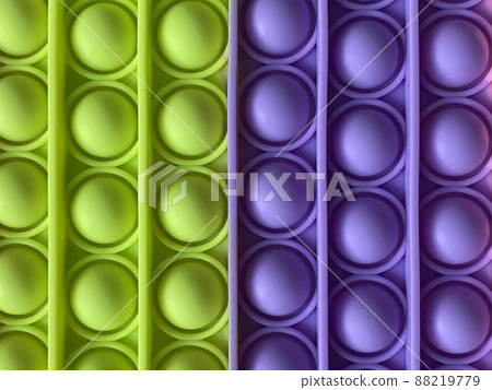 Trendy popular silicone colorful anti stress pop it toy . Close up. Someone push sensory popit. Trendy hype theme from tik tok Trendy popular silicone colorful anti stress pop it toy . Close up. Someone push sensory popit. Trendy hype theme from tik tok 88219779