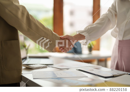 Close up of Business people shaking hands, finishing up meeting, business etiquette, congratulation, merger and acquisition concept Close up of Business people shaking hands, finishing up meeting, business etiquette, congratulation, merger and acquisition concept 88220158