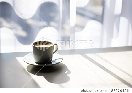 Espresso coffee cup on table near window Espresso coffee cup on table near window 88220326