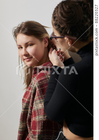 piercings on an ear. Conch and helix piercings close up. 88220327