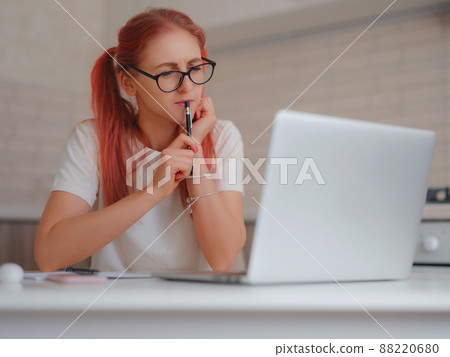 pleasant happy young female freelancer working at home 88220680