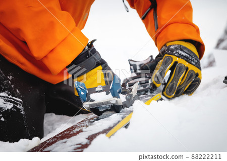 A close-up of the ski bindings as they are set up for backcountry skitouring. Sports facility skiing A close-up of the ski bindings as they are set up for backcountry skitouring. Sports facility skiing 88222211