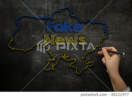 the girl writes on the blackboard the text fake news in the map of Ukraine the girl writes on the blackboard the text fake news in the map of Ukraine 88222477