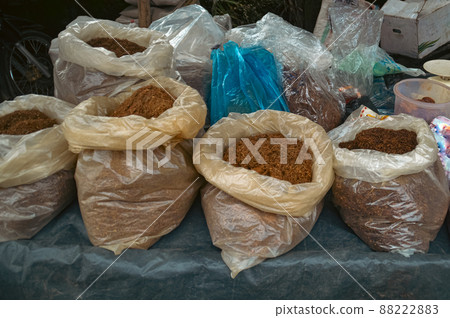 Bags full of tobacco fibers sold in the local market in Medan North Sumatra, Indonesia Bags full of tobacco fibers sold in the local market in Medan North Sumatra, Indonesia 88222883