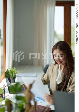 Portrait of charming young businesswoman working with laptop computer for financial on laptop in boardroom Portrait of charming young businesswoman working with laptop computer for financial on laptop in boardroom 88222884