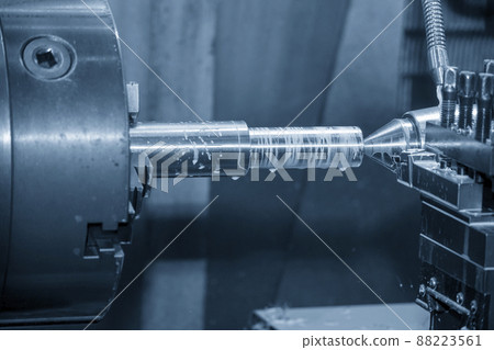 The lathe machine cutting  the metal  shaft parts with water base coolant method. 88223561