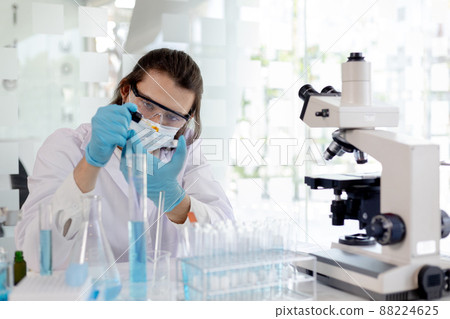 Scientists experiment with synthetic substances from nature to modify the genetics or DNA of plants to be resistant to disease, Lab experiments, Researchers scientist working analysis with test tube. 88224625