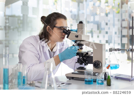 Scientists or researchers perform microscopic endoscopy to examine changes in the chemical reactions and degradation of cells, Lab experiments, Researchers scientist working analysis with test tube. Scientists or researchers perform microscopic endoscopy to examine changes in the chemical reactions and degradation of cells, Lab experiments, Researchers scientist working analysis with test tube. 88224659