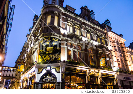 London cityscape, brick buildings and pub lights illuminated in the evening 88225860