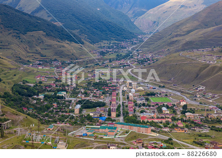 Mountain landscape with a city at the bottom of the gorge. Upper Fiagdon in North Ossetia 88226680