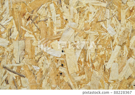 Texture of OSB panel board made of wood shavings, old pressed wood planks Texture of OSB panel board made of wood shavings, old pressed wood planks 88228367