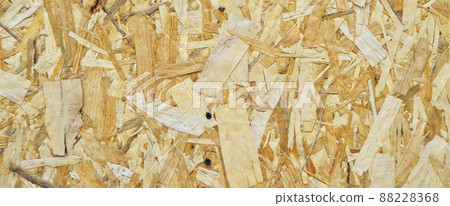 Texture of OSB panel board made of wood shavings, old pressed wood planks Texture of OSB panel board made of wood shavings, old pressed wood planks 88228368