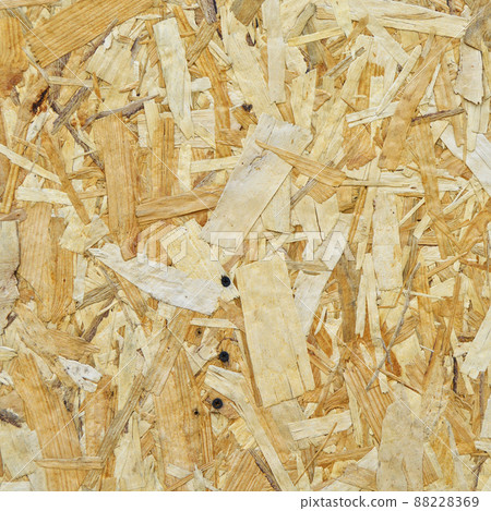 Texture of OSB panel board made of wood shavings, old pressed wood planks Texture of OSB panel board made of wood shavings, old pressed wood planks 88228369