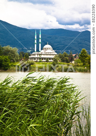 White mosque by the lake, mountain view among green reeds, Sakarya Akyazi Turkey White mosque by the lake, mountain view among green reeds, Sakarya Akyazi Turkey 88228390