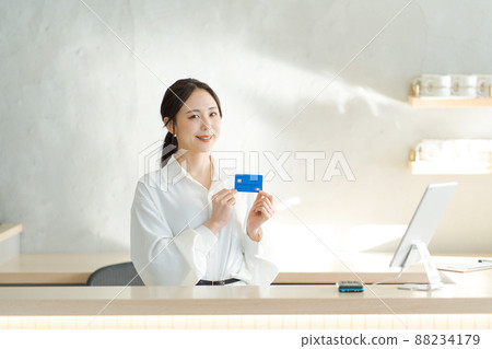 Female receptionist with a card Female receptionist with a card 88234179