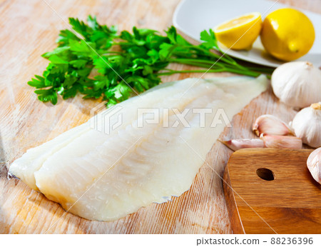 Fresh cod fillet with seasonings ready for cooking 88236396