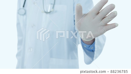 Mid section of doctor touching an invisible screen against copy space on white background Mid section of doctor touching an invisible screen against copy space on white background 88236785