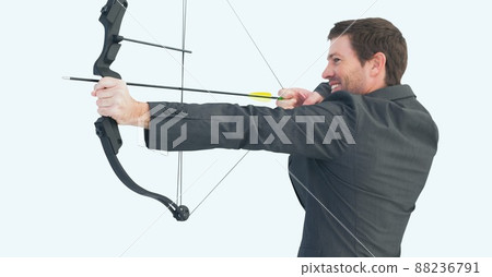 Caucasian businessman with bow and arrow against copy space on white background 88236791
