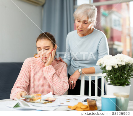 Senior woman and her daughter having financial troubles 88236963