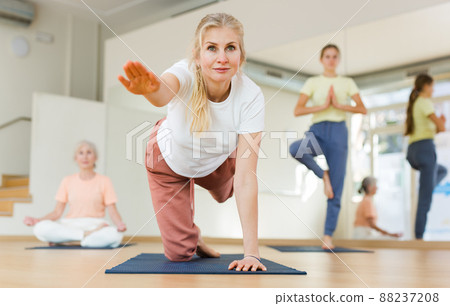 Woman doing stretching workout 88237208
