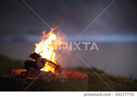 A camping necessity. Cropped view of a fire burning outdoors. 88237778