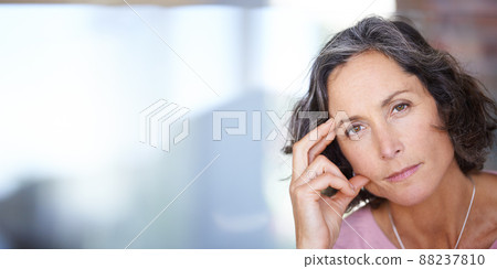 In deep reflection about the past week. Portrait shot of a mature woman looking thoughtful. 88237810