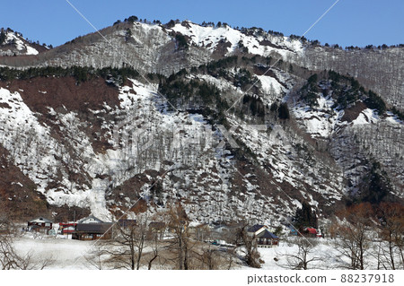 Satoyama in the thaw and a village at the foot of the mountain, Tadami Town, Fukushima Prefecture Satoyama in the thaw and a village at the foot of the mountain, Tadami Town, Fukushima Prefecture 88237918