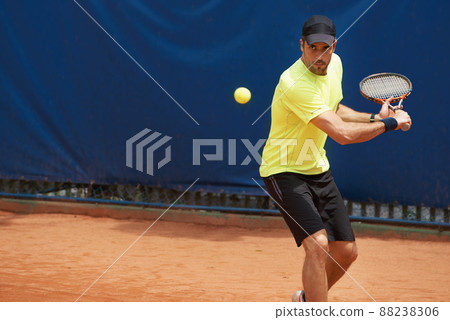 Hes king of the clay. A male tennis player on a clay court. 88238306