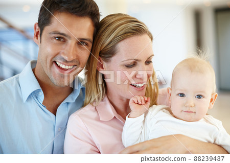 Family-where life begins and love never ends. Shot of a beautiful family enjoying time indoors. Family-where life begins and love never ends. Shot of a beautiful family enjoying time indoors. 88239487