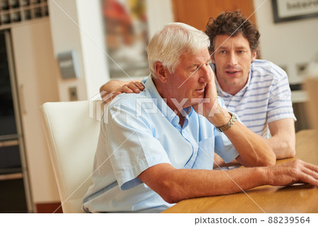 There to support each other. Shot of a man consoling his senior father at home. There to support each other. Shot of a man consoling his senior father at home. 88239564