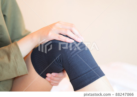A woman who is a knee supporter 88247866