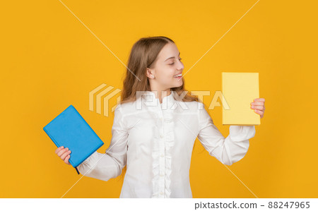 student in high school. teen girl do homework with copybook. study with workbook. student in high school. teen girl do homework with copybook. study with workbook. 88247965