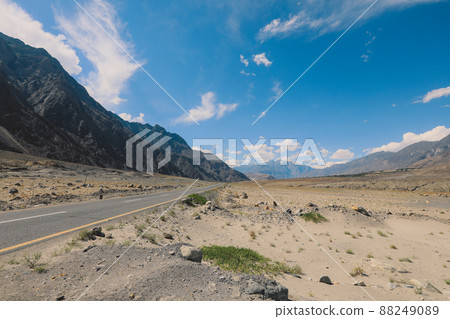 Asphalt Road in the High Gilgit Baltistan Mountains under the Blue Clouds, Pakistan 88249089
