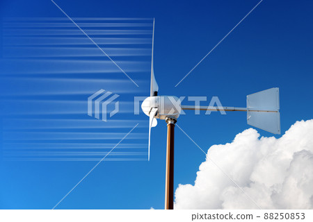 Closeup of a Small Wind Turbine against a Clear Blue Sky and Clouds Closeup of a Small Wind Turbine against a Clear Blue Sky and Clouds 88250853